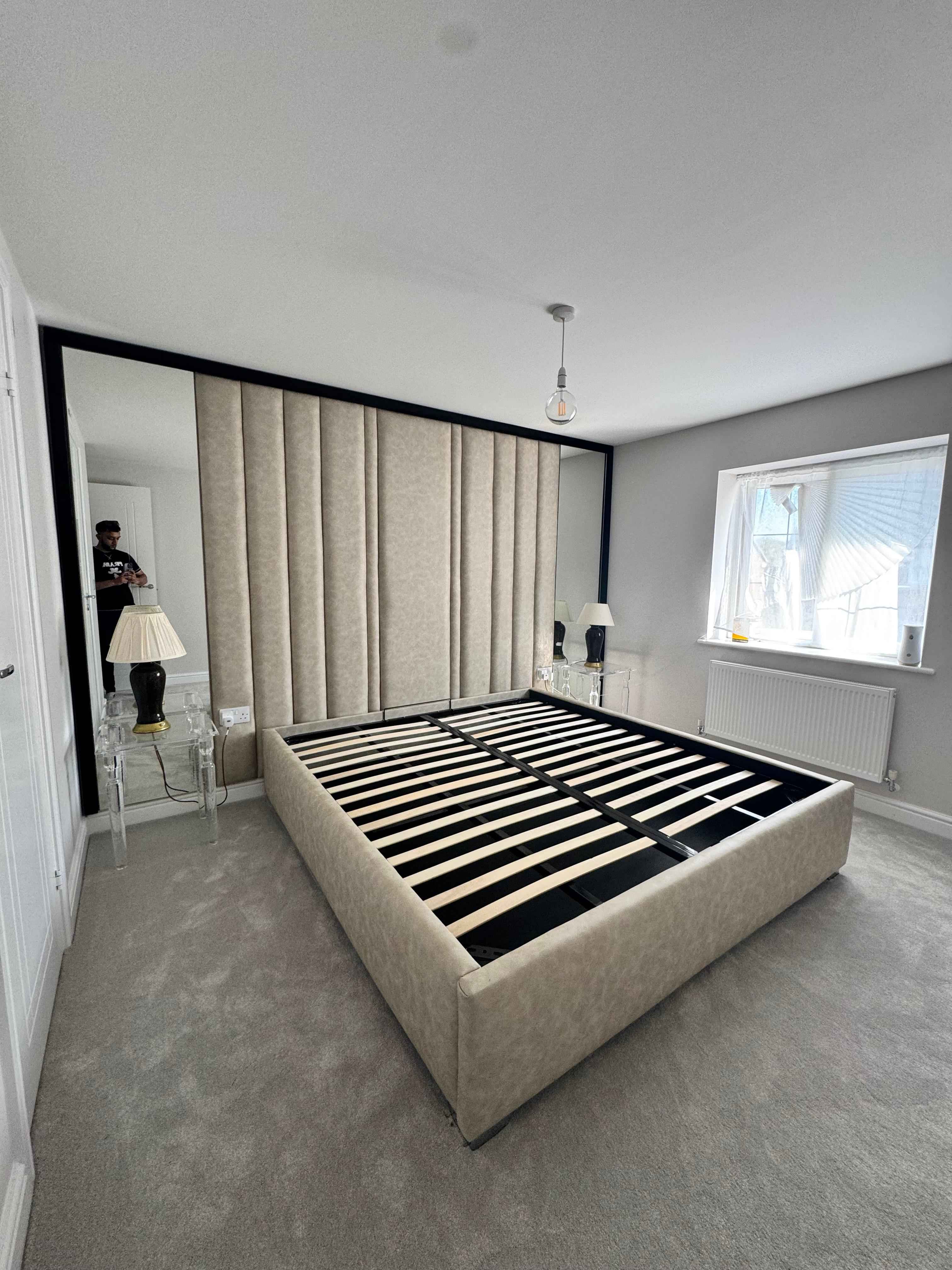 Luxury wall panel bed setup – padded wall panels creating a statement headboard wall